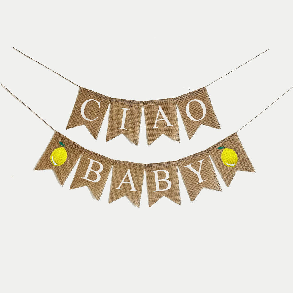 A banner with the text "Ciao Baby" written on it, with two yellow lemons on either side of the text.