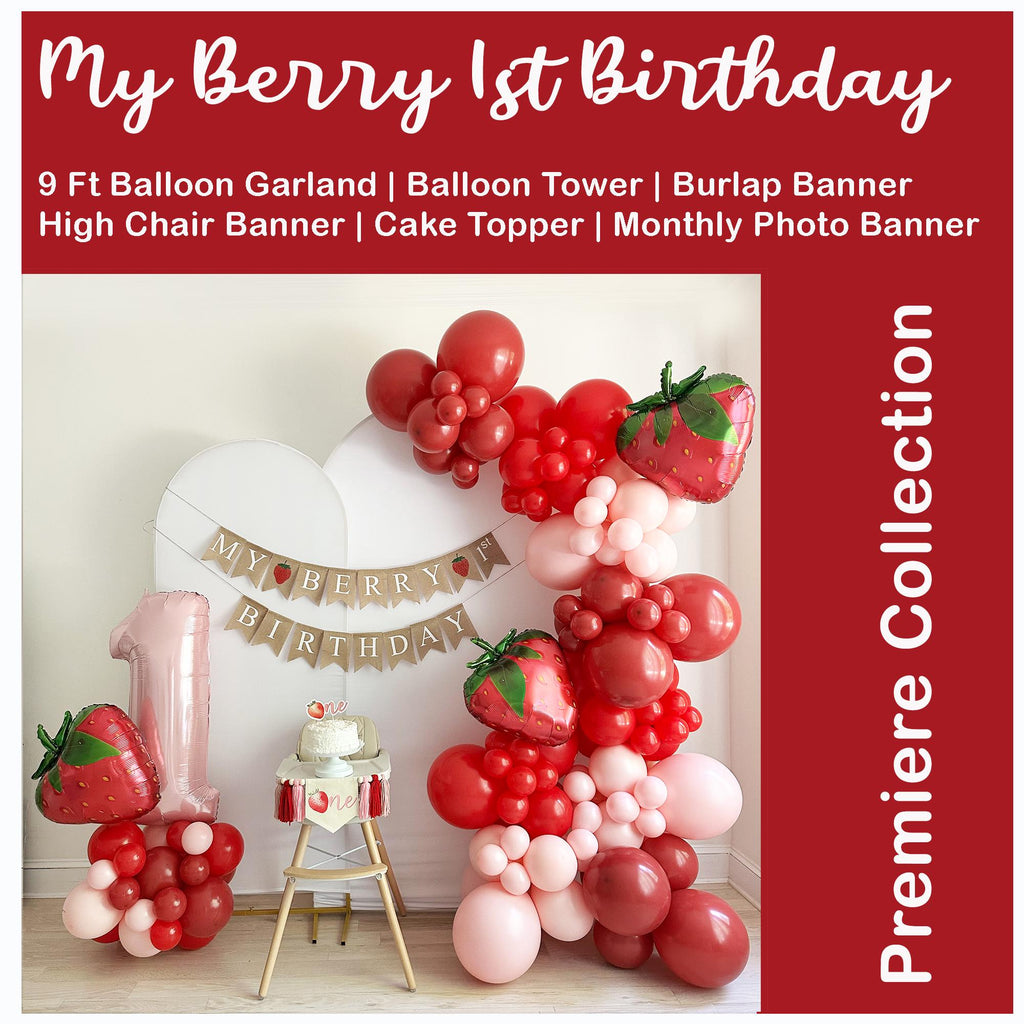 The image is a birthday party setup with a large balloon arch, a cake, and a high chair. The backdrop is decorated with a banner that reads "My Berry 1st Birthday".