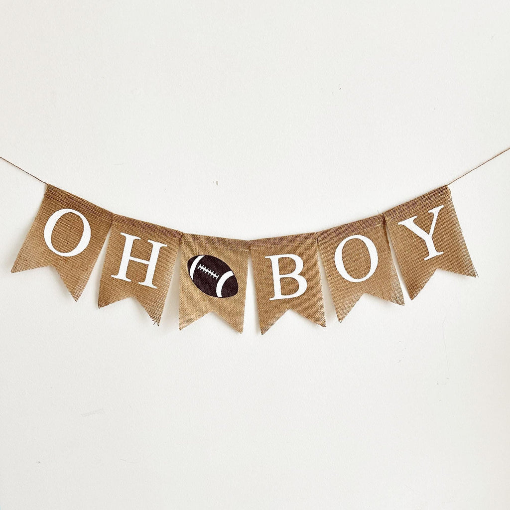 A banner with the word "OH BOY" written on it, with a football image between the words.