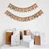 a festive display with a banner that reads "The SUMMER I TURNED 40", surrounded by gift bags and boxes.