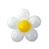 A group of white balloons arranged in the shape of a flower, with a yellow balloon at the center.