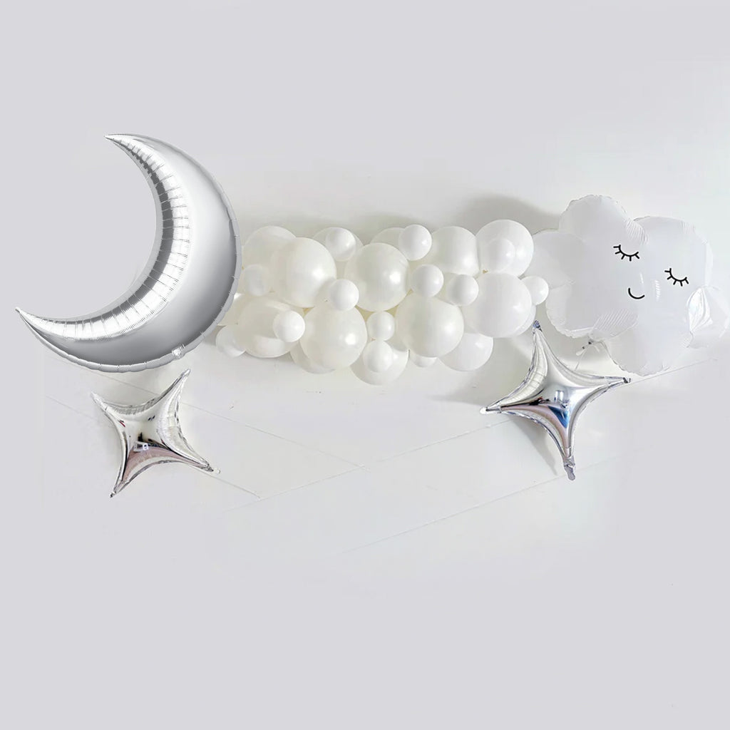 a collection of white balloons and silver stars arranged on a white background.