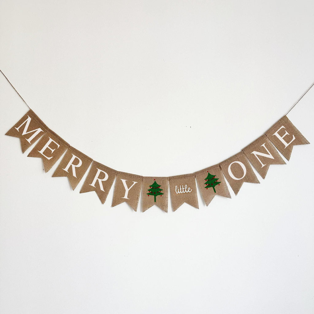 A banner with the word "MERRY" written on it, along with a small green tree icon.