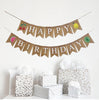 A Happy Birthday burlap banner with fruit themed flags surrounding the words.