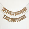 A banner with the words "MY FIRST RODEO" written on it, along with small images of cowboy boots.