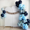 a festive display with a banner that reads "Sweet Baby" and numerous blue and white balloons arranged in a decorative manner.