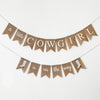 A banner with the text "a little cowgirl is on the way" hanging on a white background.