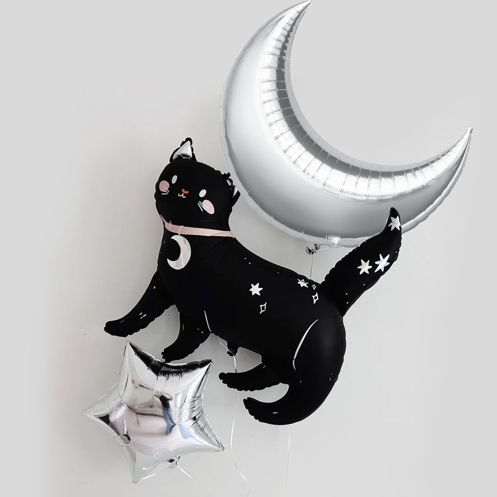 a black cat balloon and a silver crescent moon balloon, both adorned with white stars, creating a whimsical and festive atmosphere.