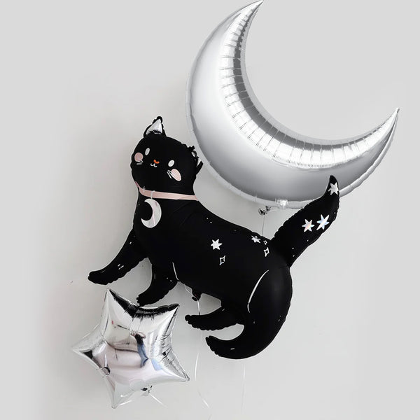 a black cat balloon and a silver crescent moon balloon, both adorned with white stars, creating a whimsical and festive atmosphere.