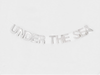 the words "UNDER THE SEA" in a decorative banner.