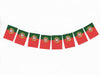 A row of red and green flags with the national emblem of Portugal displayed on them.