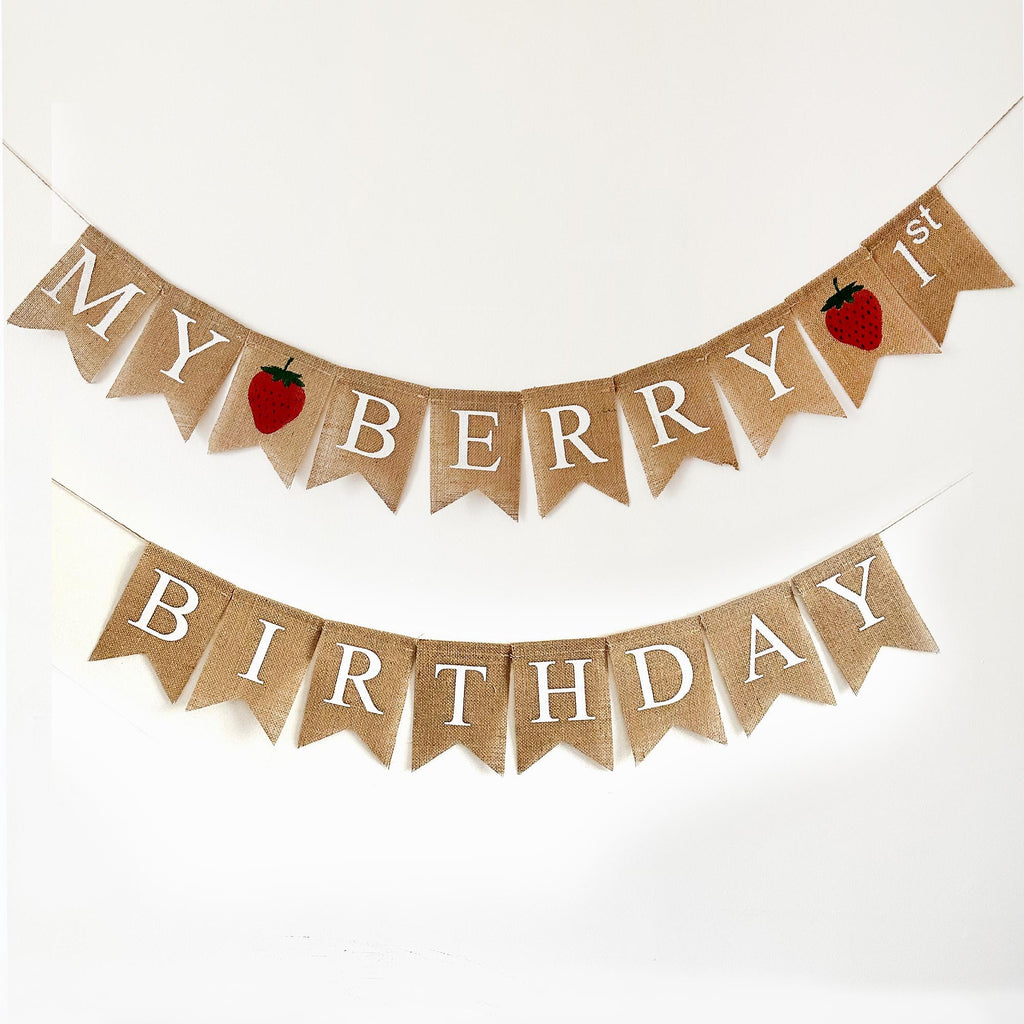 A banner with the text "MY BERRY BIRTHDAY" written on it, along with two red strawberries.