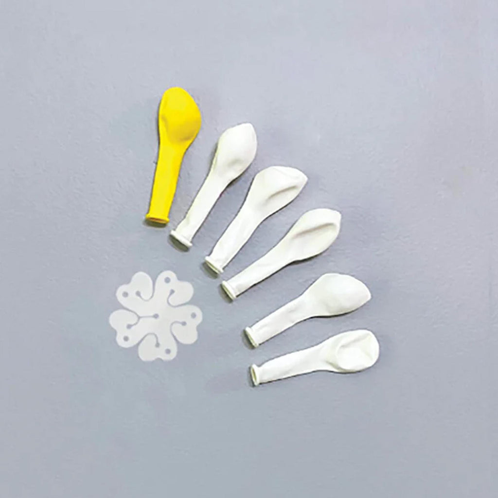 a yellow balloon and five white balloons arranged on a gray background.