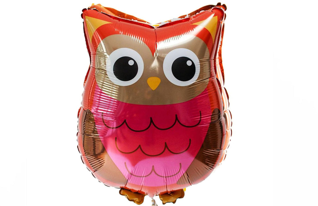 A red and gold foil balloon in the shape of an owl with large eyes and a small beak.