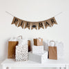 A burlap banner reading pie bar in white lettering with a pie image between the words.