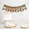 Celebrate one with this white pumpkin burlap banner. With unique white pumpkins on each end and the letters o n e spelled out in between in white lowercase letters, this banner is perfect for a fall first birthday celebration.