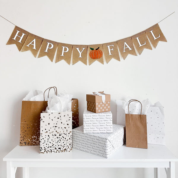 Happy Fall Burlap Banner with an orange hand stenciled pumpkin in between the two words. Each flag is 4.5 x 6.5 making this banner perfect for a photo backdrop or fireplace mantel decor.