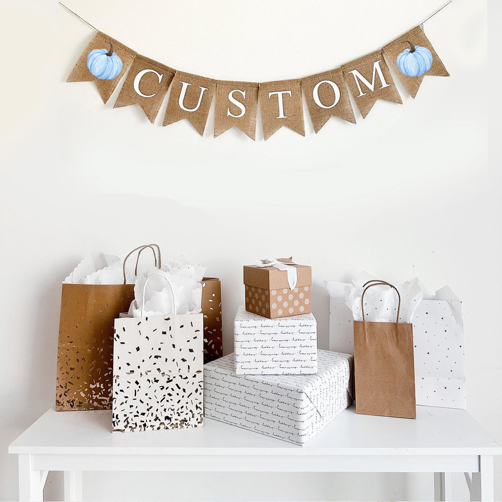 Customize this burlap banner with blue water colored pumpkins. With white letters on top of fishtail burlap flags, this banner is the perfect way to personalize a fall celebration
