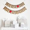 A two line burlap banner with white letters spelling out the words Love Is on the first line and In Bloom on the second line. There is a bright red heart between the words Love and Is and another red heart between in and bloom making this a perfect love filled banner design.
