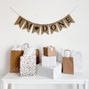 A burlap banner made from 4.5 by 6.5 inch fishtail shaped flags. Each flag has a pocket across the top for stringing. This banner says I&#39;M DONE in black capital letters. There is a hand stenciled image of a black graduation cap with a blue tassel in between the words. It is strung on a jute string that is 110 inches in length.