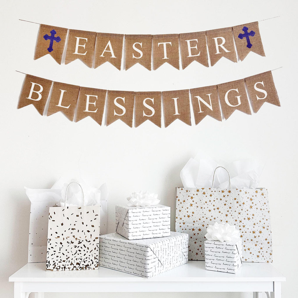 Easter Blessings burlap banner is on two lines, the top line has a purple cross and then spells out Easter with a purple cross at the end. The second line spells out the word Blessings. The letters are in white font on fishtail burlap flags. Perfect for a religious Easter celebration.