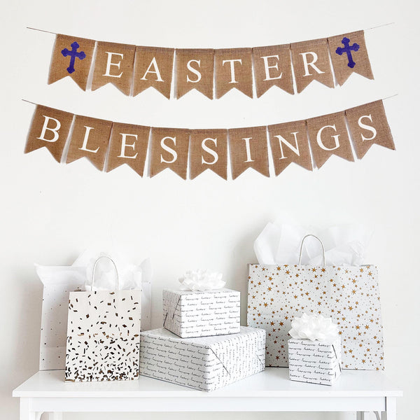 Easter Blessings burlap banner is on two lines, the top line has a purple cross and then spells out Easter with a purple cross at the end. The second line spells out the word Blessings. The letters are in white font on fishtail burlap flags. Perfect for a religious Easter celebration.