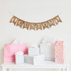 A burlap banner with the wording CUSTOM between two pink footprint image flags.