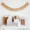 A burlap banner made from 4.5 by 6.5 inch fishtail shaped flags. Each flag has a pocket across the top for stringing. It says LET&#39;S PAR-TEE in white capital letters with a dash between PAR and TEE. There is an image of a white golf ball sitting on a black tee in between the words. It is strung on a jute string that is 110 inches in length.