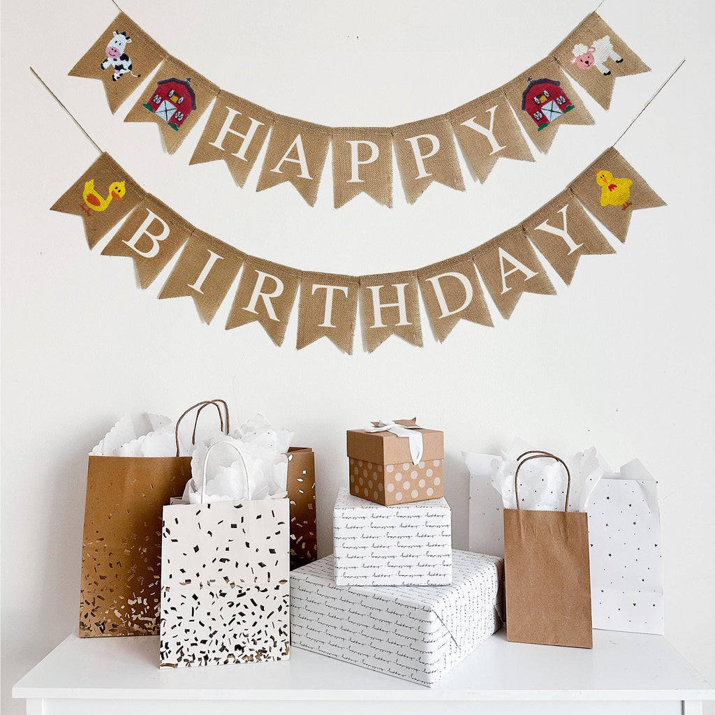 This Barn Themed Happy Birthday Banner is on two lines. The first line starts with a hand stenciled cow design followed by a detailed red barn. The flags then spell out the word Happy followed by another red bard and a sheep. The second line starts with a yellow duck followed by the word Birthday and ends with a yellow chick. With the inclusion of all of these barn inspired designed on this burlap banner, it&#39;s the perfect addition to any farm themed party.
