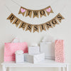A burlap banner made from 4.5 by 6.5 inch fishtail shaped flags. Each flag has a pocket across the top for stringing. The top line says TWO in black capital letters and has a pink heart on each end. The bottom line says BLESSINGS in black capital letters. It is strung on two 110 inch jute strings.