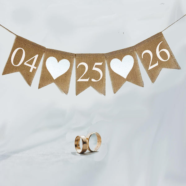 This is a customizable wedding date banner. Add your custom date in black or white numbers over fishtail flags. Between each number in the date you have your choice of red hearts or white hearts.