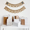 A burlap banner made from 4.5 by 6.5 inch fishtail shaped flags. Each flag has a pocket across the top for stringing. The top line of this banner says HAPPY in white capital letters and has a hand stenciled image of a blue Menorah on each end. The bottom line says HANUKKAH in white capital letters. It is strung on two 110 inch jute strings.