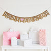 A burlap banner that says baby custom with a pink heart between the words.