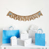 A burlap banner made from 4.5 by 6.5 inch fishtail shaped flags. Each flag has a pocket across the top for stringing. This is a custom banner in white capital letters. Add the name of your choosing to personalize this banner. There is a hand stenciled image of a grey elephant with blue ears on each end of the name. It is strung on a jute string that is 110 inches in length.