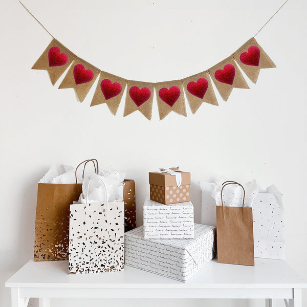This 8 flag burlap banner has a red glitter heart on each flag making it the perfect backdrop decor for a Valentine&#39;s Day celebration.