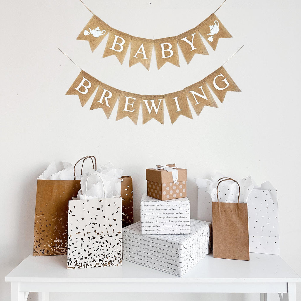 This two tiered banner spells out the word BABY on the first line with an image of a tea pot and tea cup on either end of the word. The second line spells out BREWING. Each burlap flag is 4.5 inches by 6.5 inches.