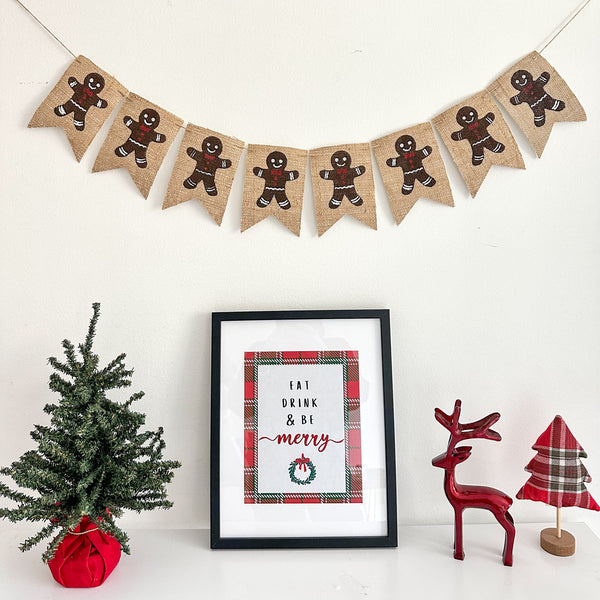 A burlap banner with gingerbread men painted onto 4x6in fishtail flags.